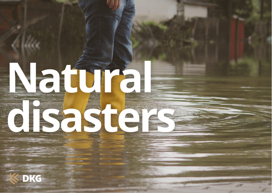 Image of person's legs wearing jeans and yellow gum boots wading through flood waters with the heading natural disasters